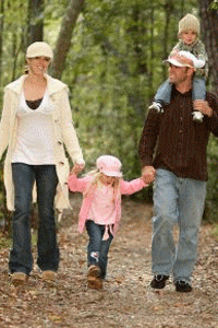 A picture of a family hiking in the woods