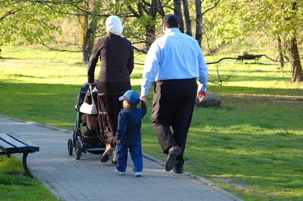 Family walking in park together
